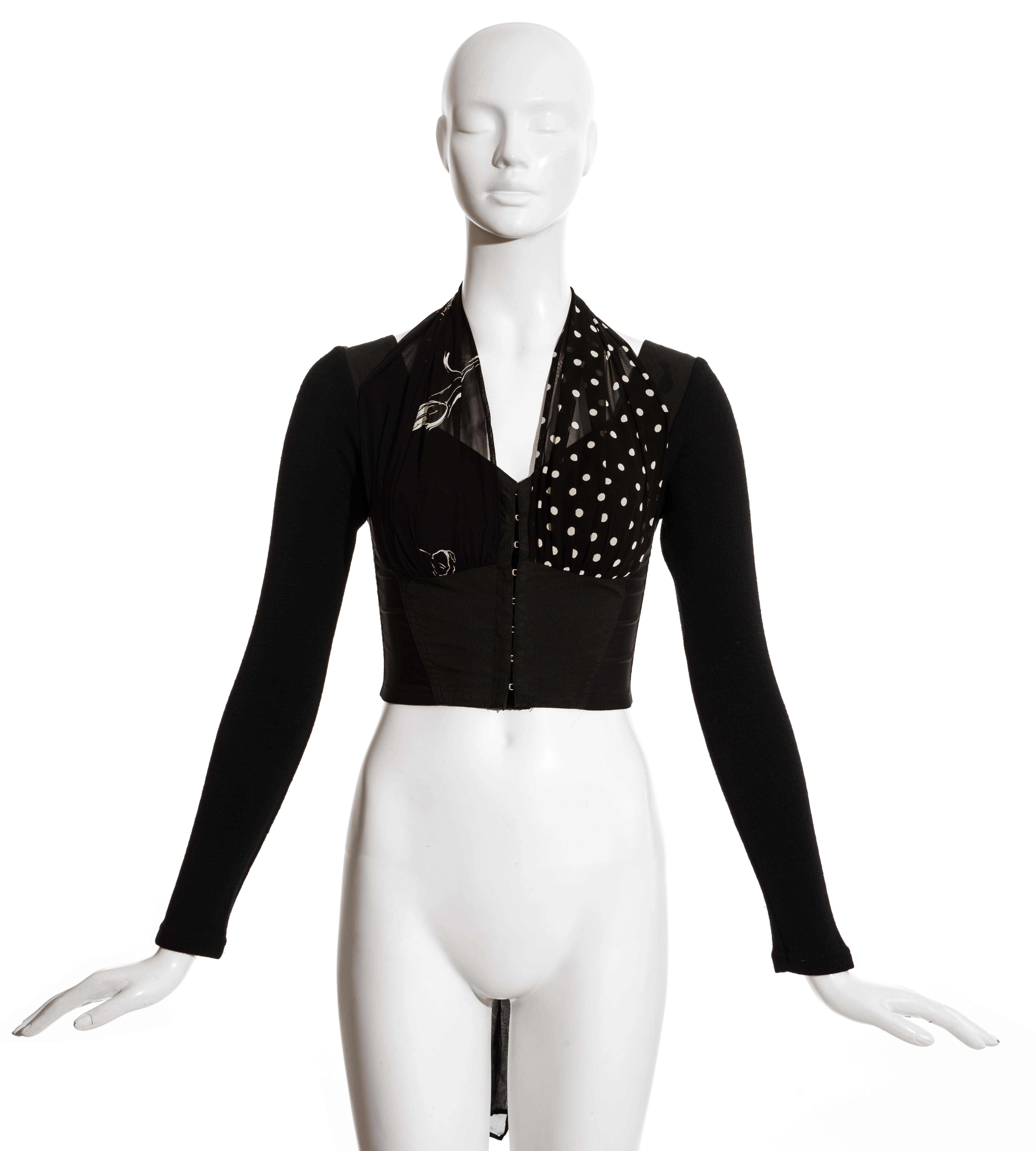 Dolce & Gabbana black spandex corset top with fitted wool sleeves and printed silk scarfs attached to the bust; can be styled in various ways.

Spring-Summer 1991