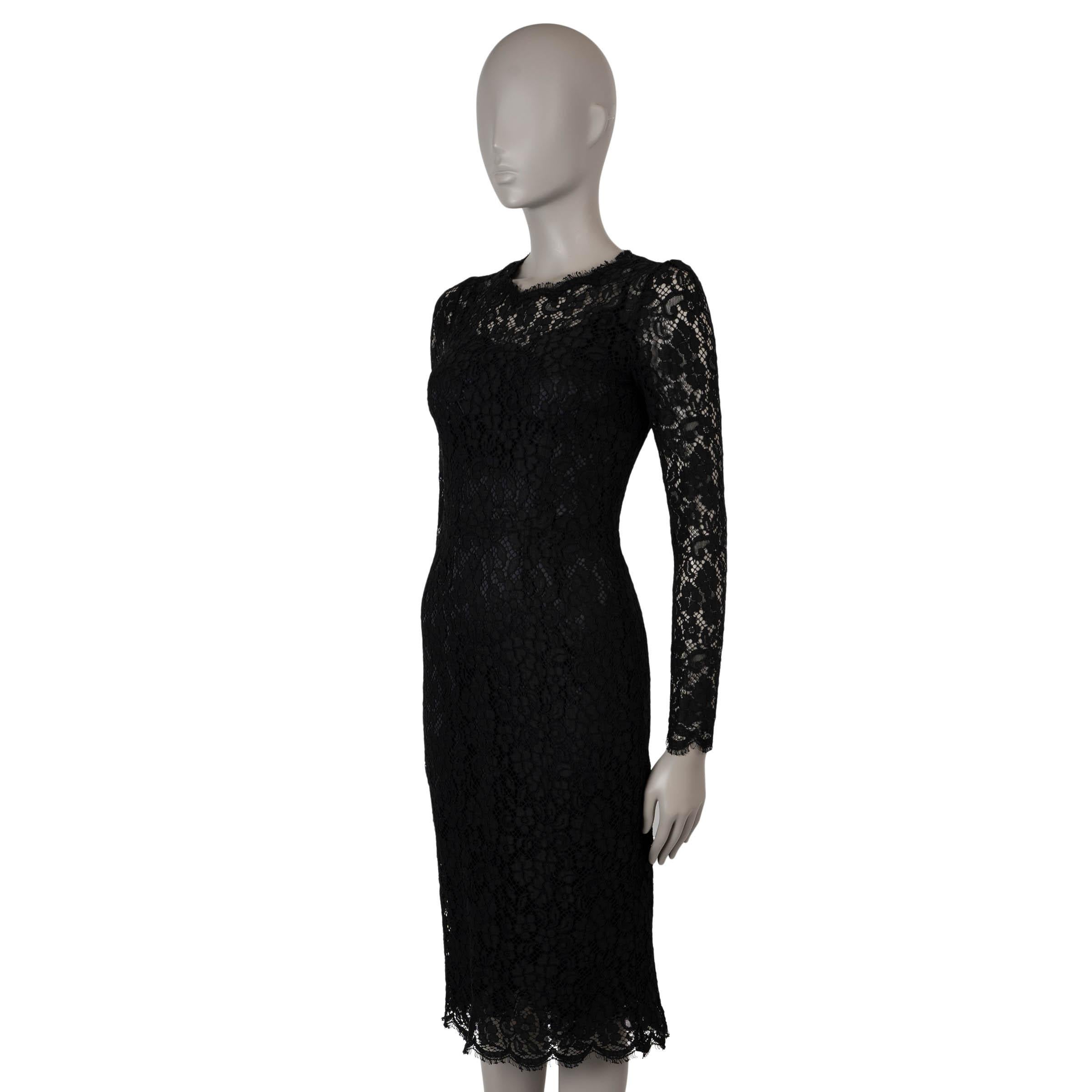 This 100% authentic Dolce & Gabbana cocktail dress is crafted from cordonetto lace in a blend of cotton (49%), polyamide (40%), and viscose (11%). It features a fitted, midi-length silhouette with a floral lace pattern and elegant scalloped edges.