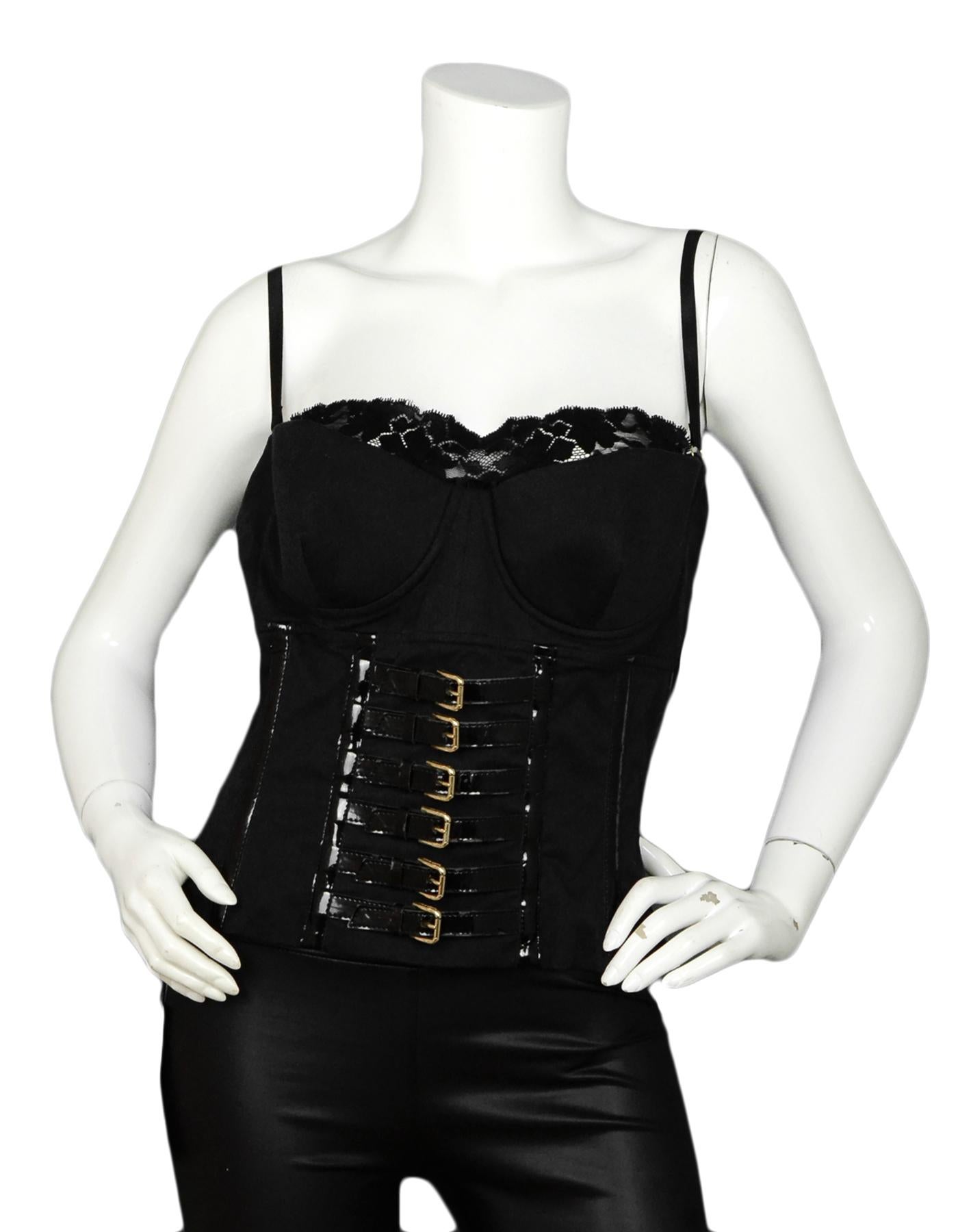 Dolce & Gabbana Black Cotton Blend Bustier w/ Gold Buckles sz IT46

Made In: Italy 
Color: Black
Materials: 83% Cotton, 2% Elastane, 3% Polyester, 12% Polyurethane
Lining: 84% Cupro, 16% Elastane
Opening/Closure: Back zip
Overall Condition:
