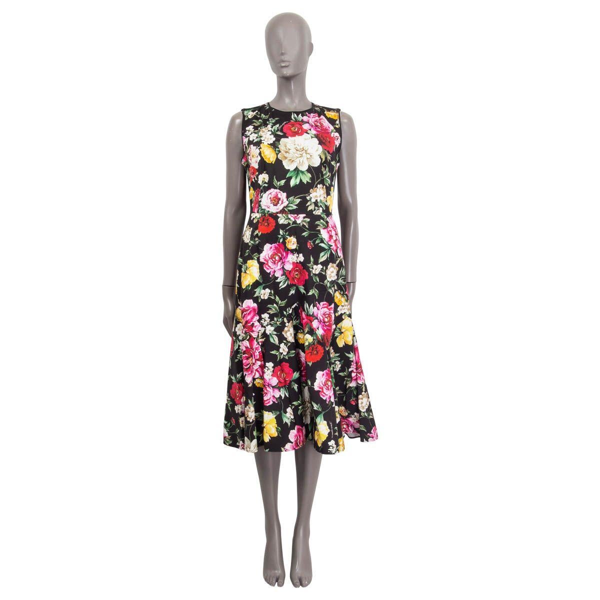 100% authentic Dolce & Gabbana sleeveless flared dress in black, yellow, white, red, pink and green cotton (97%) and elastane (3%). Features a floral print and opens with a concealed zipper and a hook on the back. Unlined. Has been worn and is in