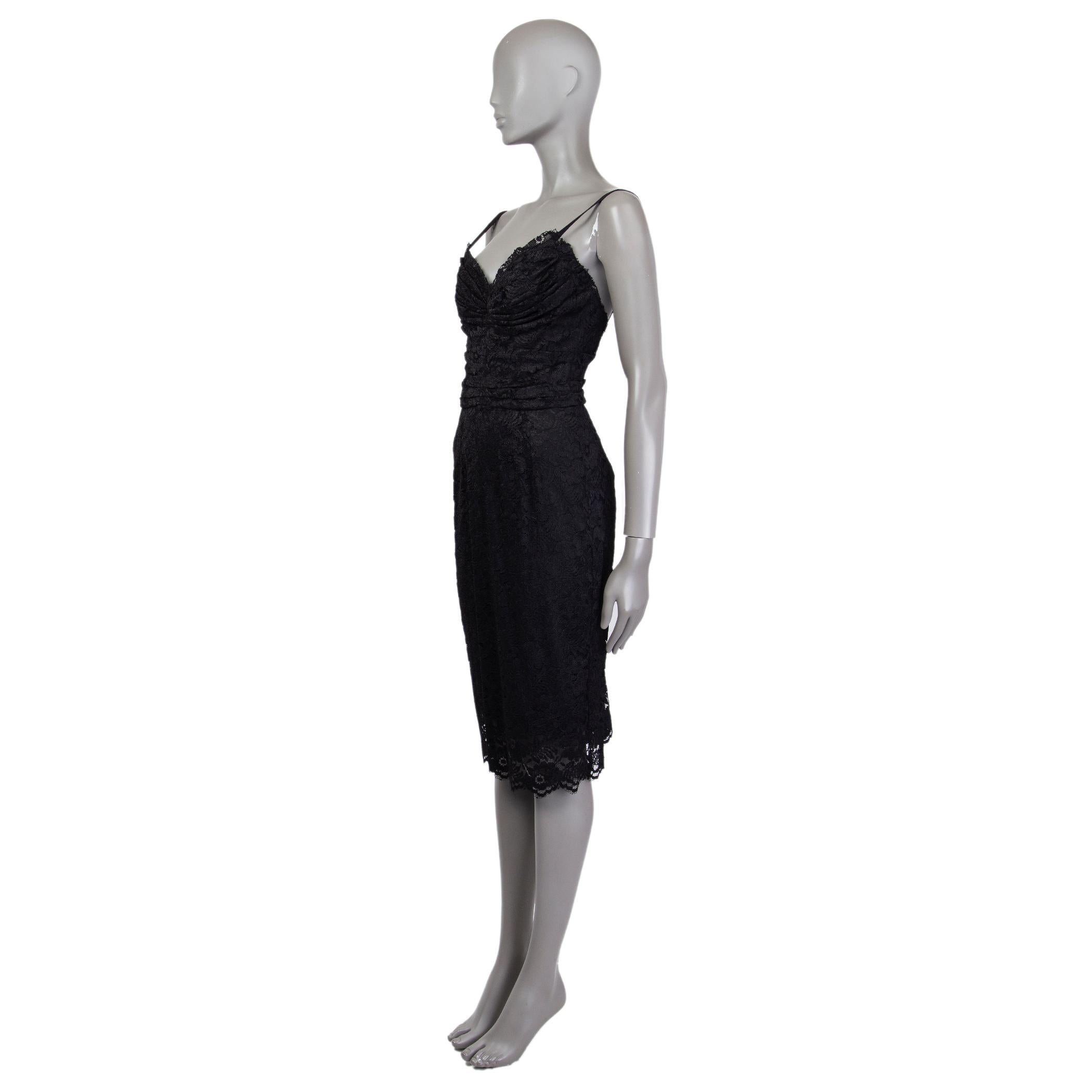 Dolce & Gabbana bustier lace sheath dress in black viscose (90%) and nylon (10%). With with pleated bust and spaghetti straps. Closes with concealed hook and metal zipper on the back. Lined in black silk (96%) and elastane (4%). Has been worn and is