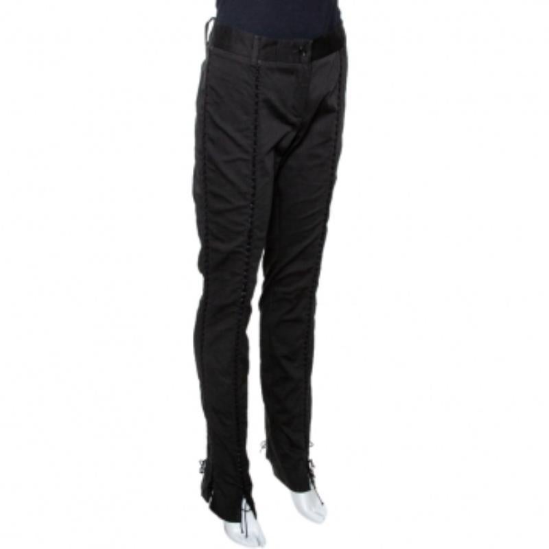 These stylish & versatile pants from Dolce & Gabbana are great for a host of occasions. Crafted from cotton, it comes in a classic shade of black. They have a fitted silhouette, lace-up detailing, belt loops and button closure.