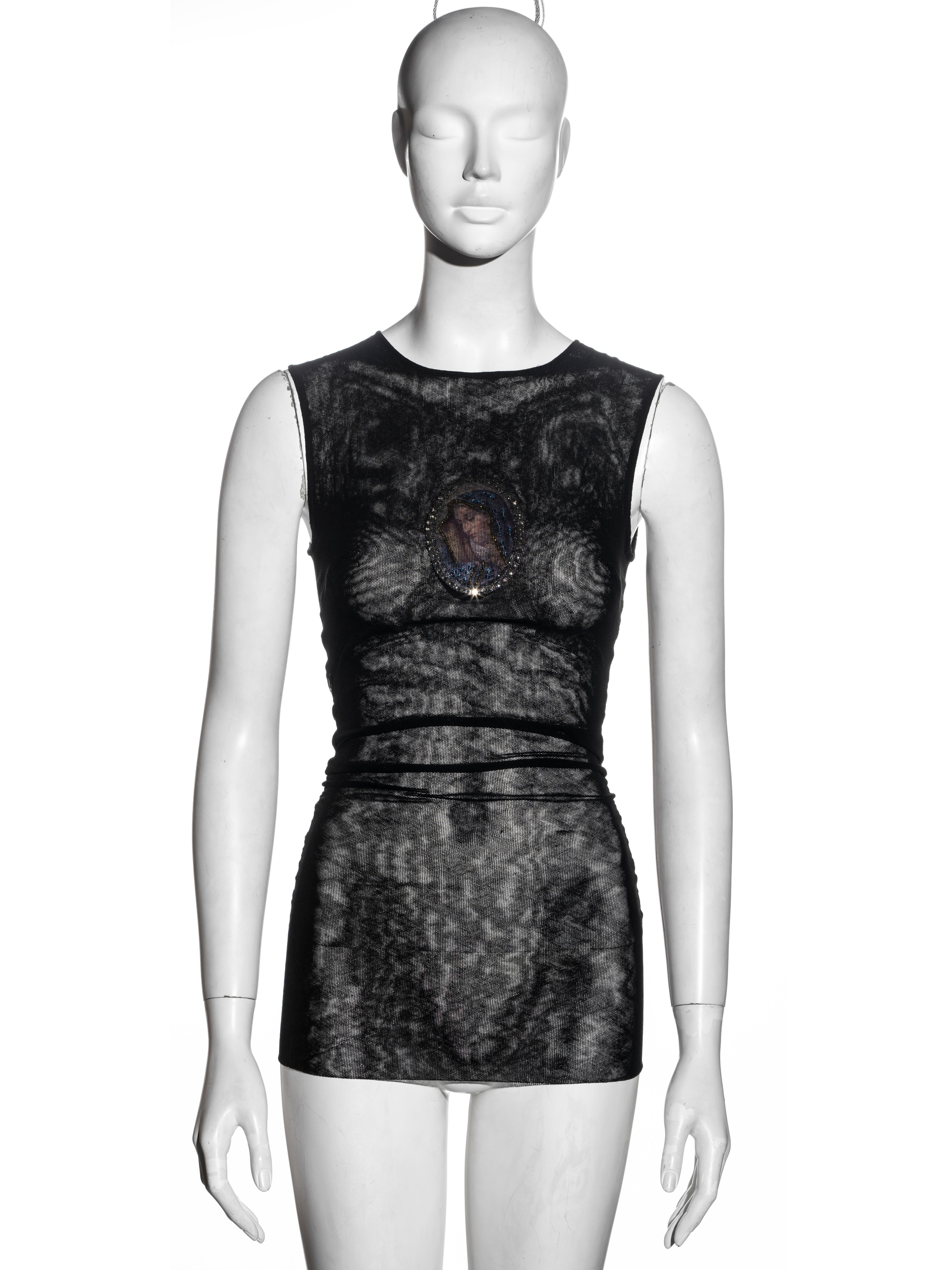 ▪ Dolce & Gabbana sleeveless evening top
▪ Black cotton mesh 
▪ Ruched seams
▪ Virgin Mary with crystals 
▪ Double layered
▪ Skin tight
▪ Size XS / S
▪ Spring-Summer 1998
▪ 66% Cotton, 34% Lycra
▪ Made in Italy