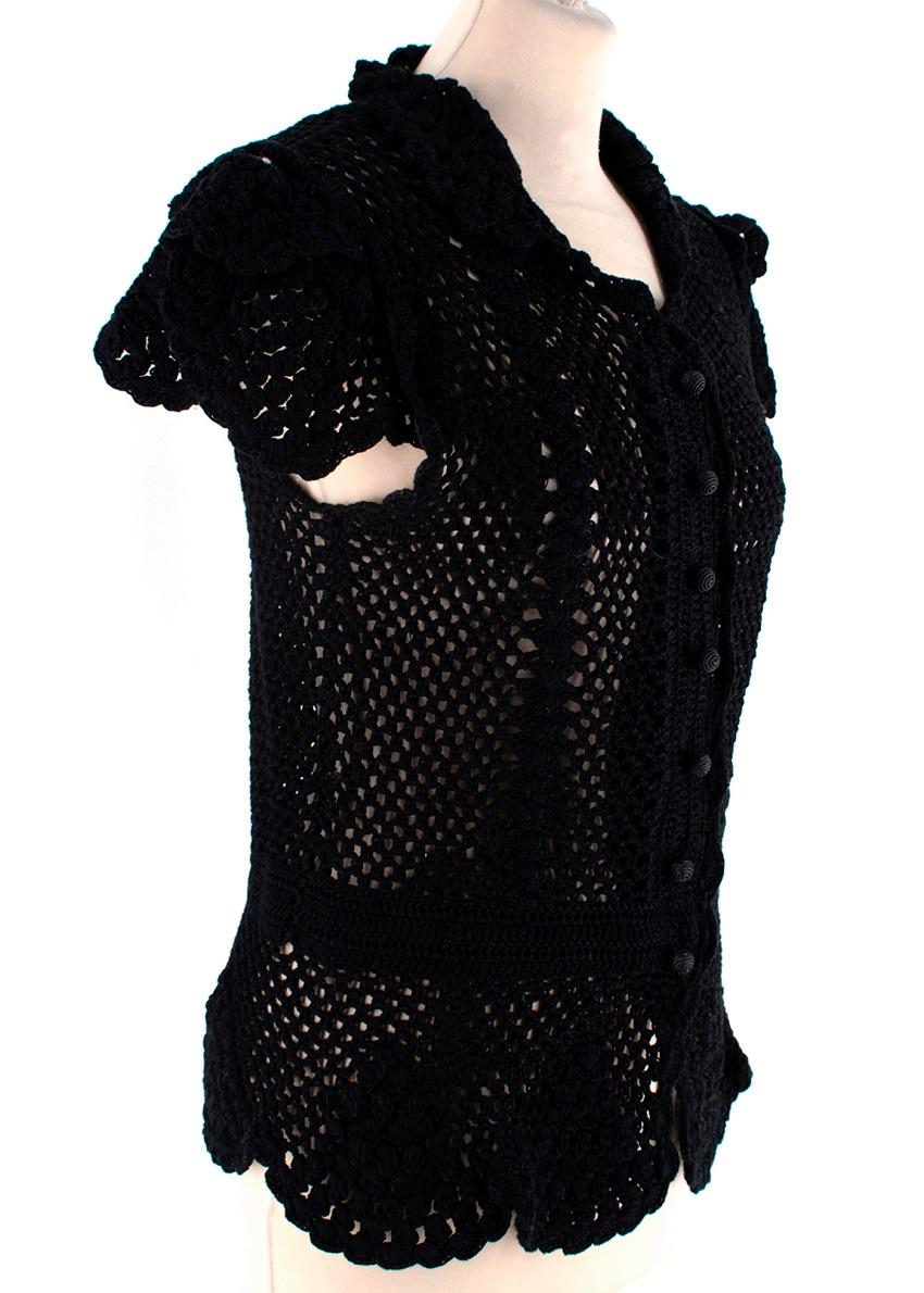 Dolce & Gabbana Black Cotton Sleeveless Crochet Cardigan

-Made of soft cotton 
-Gorgeous crochet motif 
-Sleeveless classic cut
-Petals like detail to the shoulders
-Round neckline 
-Button fastening to the front 
-Neutral easy to style elegant