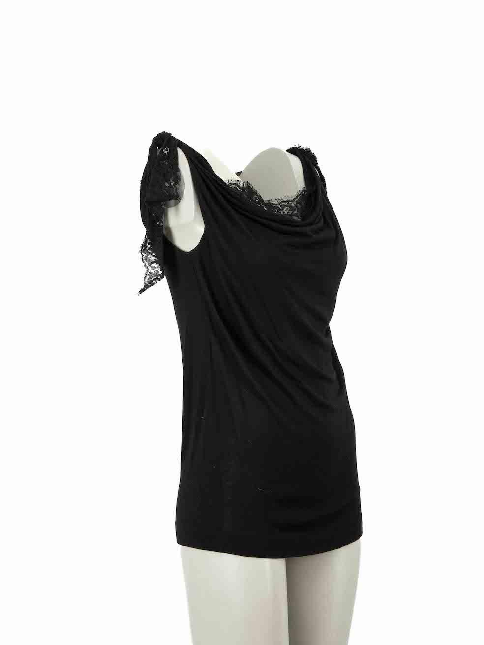 CONDITION is Very good. Minimal wear to top is evident. Minimal wear to lace detailing with a number of small thread pulls seen at the shoulders on this used Dolce & Gabbana designer resale item.
 
Details
Black
Viscose
Sleeveless tank top
Slightly