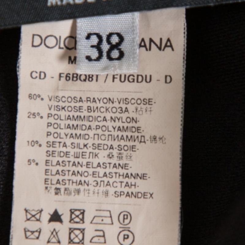 Make a breezy style statement with this chic dress from Dolce & Gabbana. Designed beautifully, this black creation is a fabulous casual dress. It is fashioned as sleeveless with pockets and a zipper fastening.