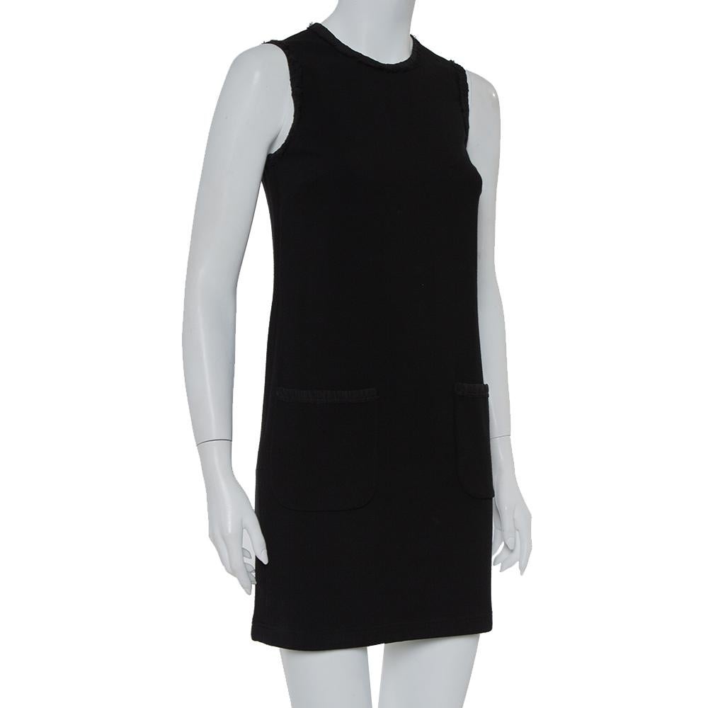 Make a breezy style statement with this chic dress from Dolce & Gabbana. Designed beautifully, this black creation is a fabulous casual dress. It is fashioned as sleeveless with pockets and a zipper fastening.

