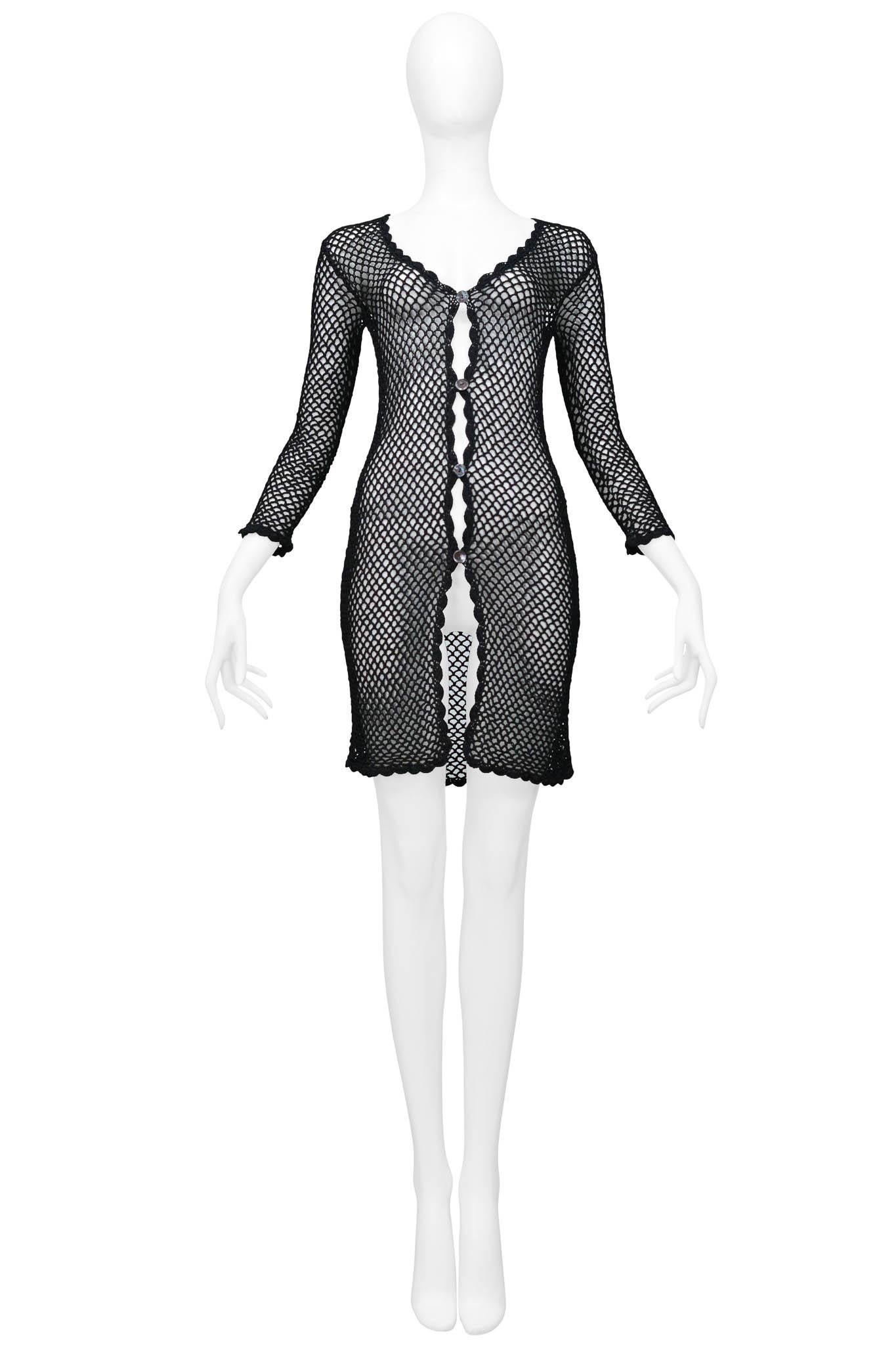 Resurrection Vintage is excited to offer a vintage Dolce & Gabbana black fishnet cardigan dress featuring a crochet fishnet weave, scalloped trim, and button closure.

Dolce & Gabbana
Size Small
Nylon
Excellent Vintage Condition 
Authenticity