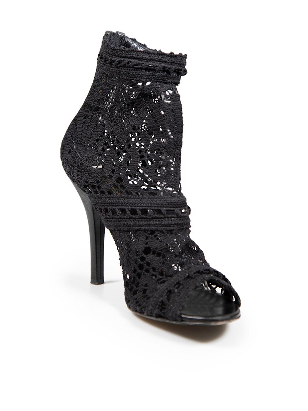 CONDITION is Good. Minor wear to boots is evident. Light signs of indents and abrasion to both heels. Minor abrasions to the tip of both shoes on this used Dolce & Gabbana designer resale item.
  
  Details
  
  
  Black 
  
  Cloth textile 
  
 