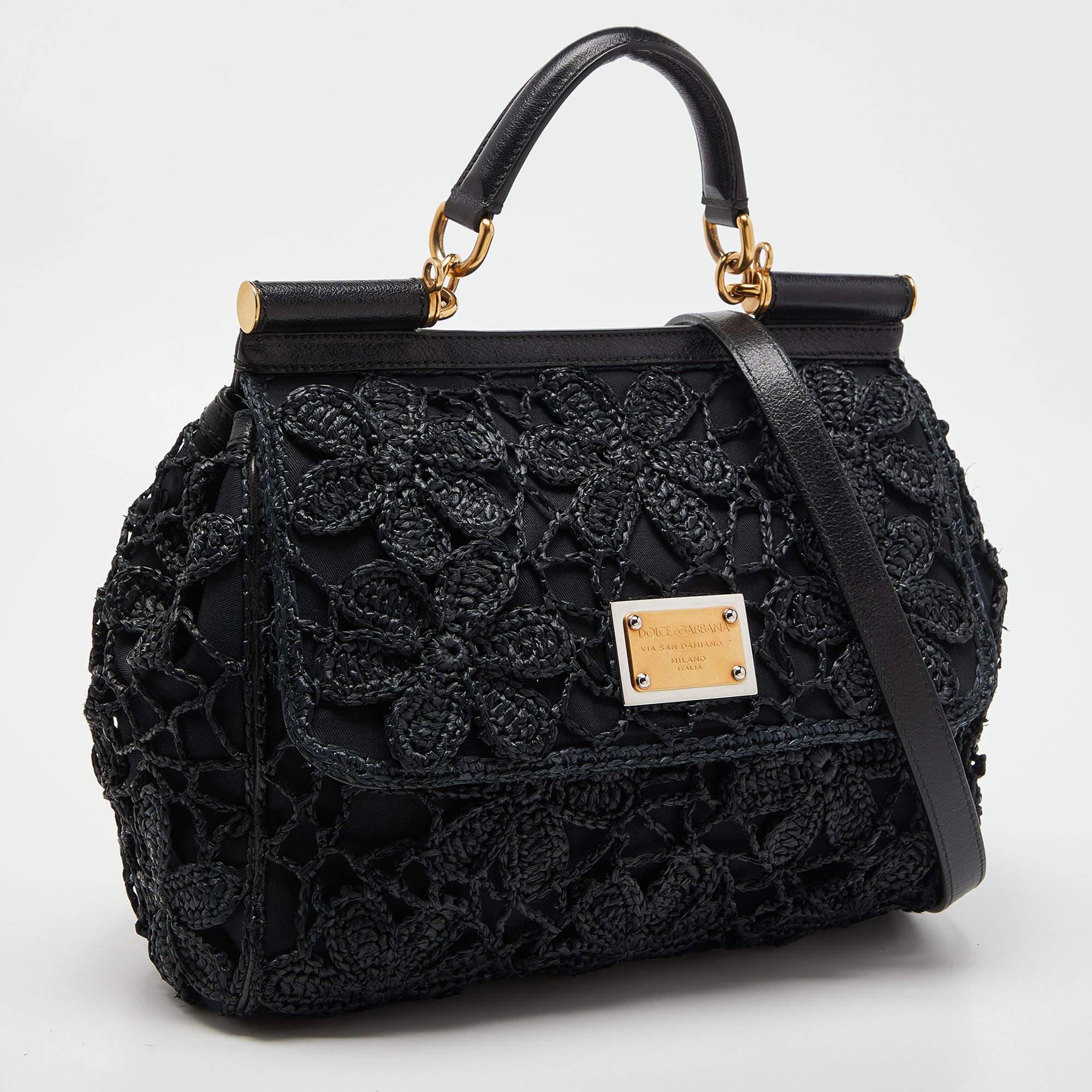 The iconic Miss Sicily bag by Dolce & Gabbana is named after Domenico Dolce's native land and exhibits the aesthetic of Italian glamour. The bag is crafted into a neat silhouette and is complemented with luxe hardware.

