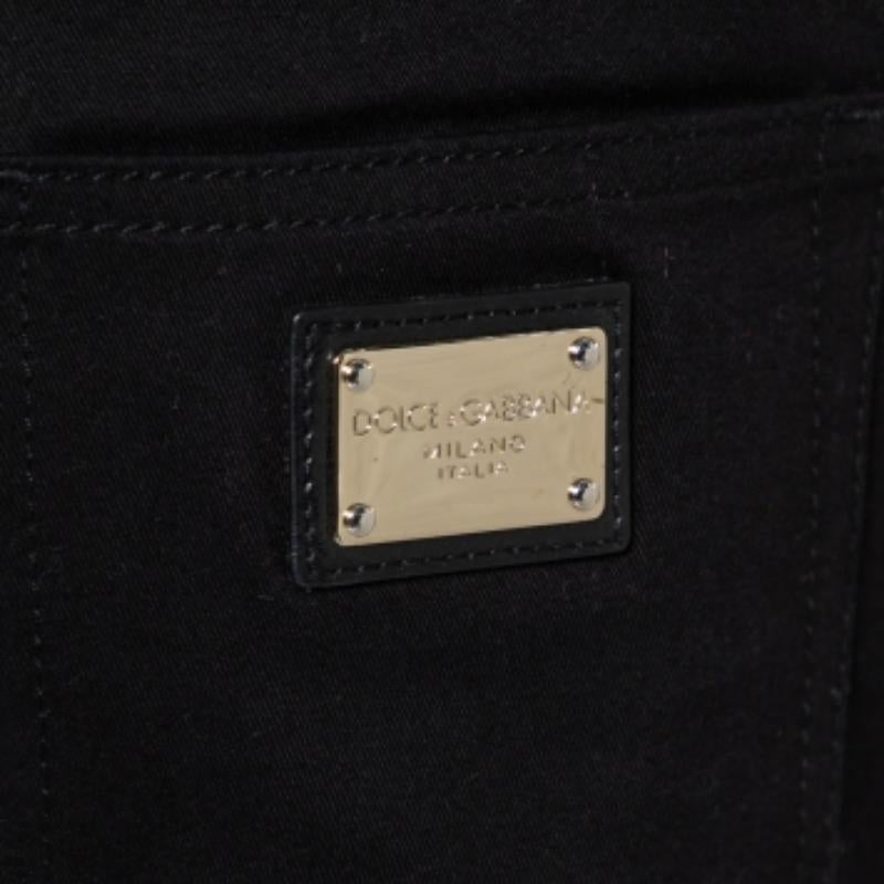 These fabulous black jeans by Dolce & Gabbana are a must-have. Crafted from a cotton blend, the pair is cut to a skinny fit and detailed with five pockets, button-zip closure, belt loops, and the brand plaque at the back.
