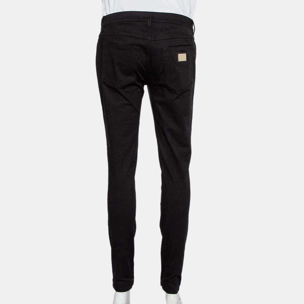 These fabulous black jeans by Dolce & Gabbana are a must-have. Crafted from a cotton blend, the pair is cut to a skinny fit and detailed with five pockets, button-zip closure, belt loops, and the brand plaque at the back.

