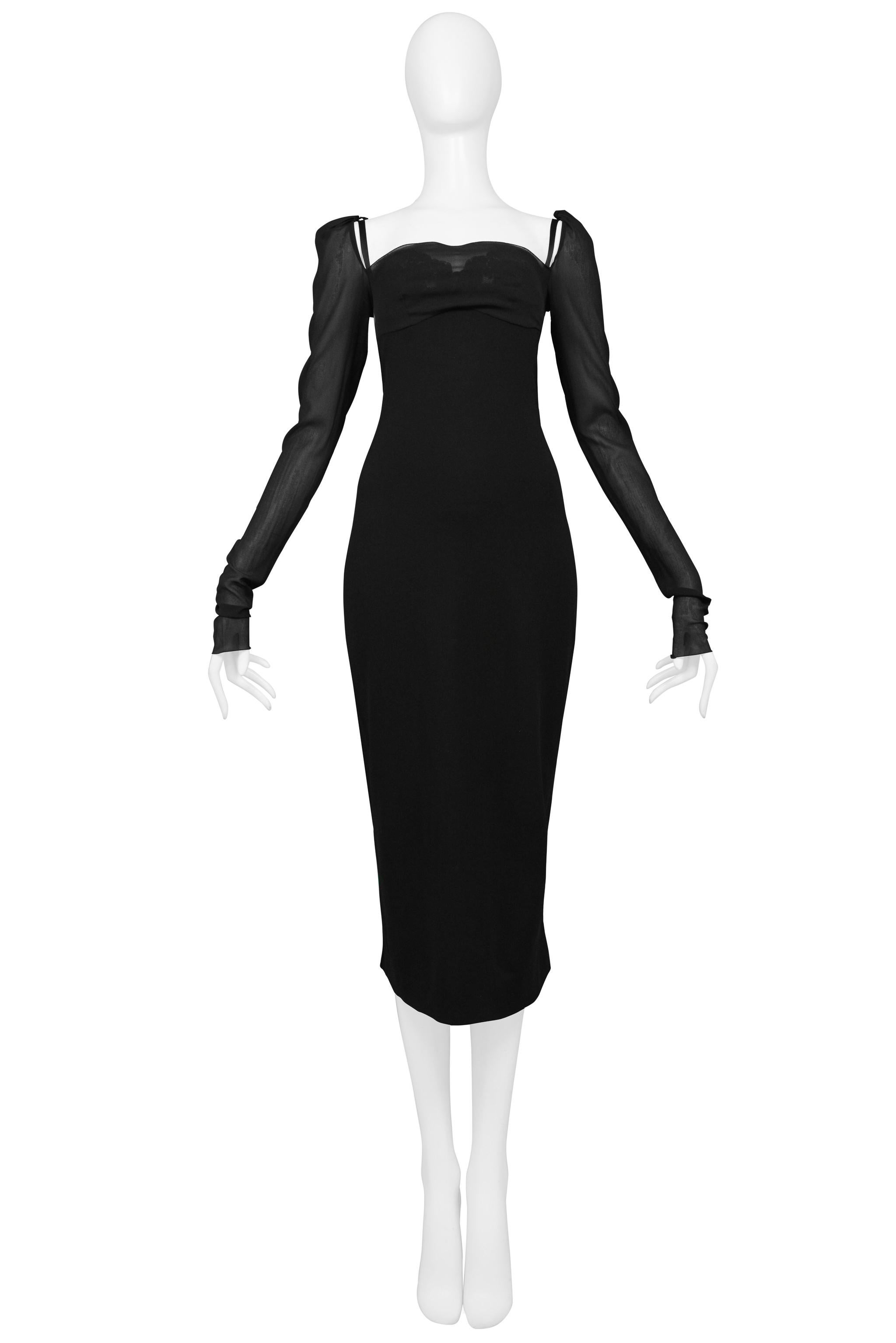 Resurrection Vintage is excited to offer a vintage Dolce & Gabbana black wiggle dress featuring a chiffon front bodice panel with attached under bra, adjustable straps, sheer extra long princess sleeves, and center back zipper. 

Dolce &