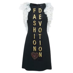 Dolce
Gabbana - Mini abito nero in crepe ricamato e con maniche in pizzo - S Dolce
Gabbana - Mini abito nero in crepe ricamato e con maniche in pizzo - S