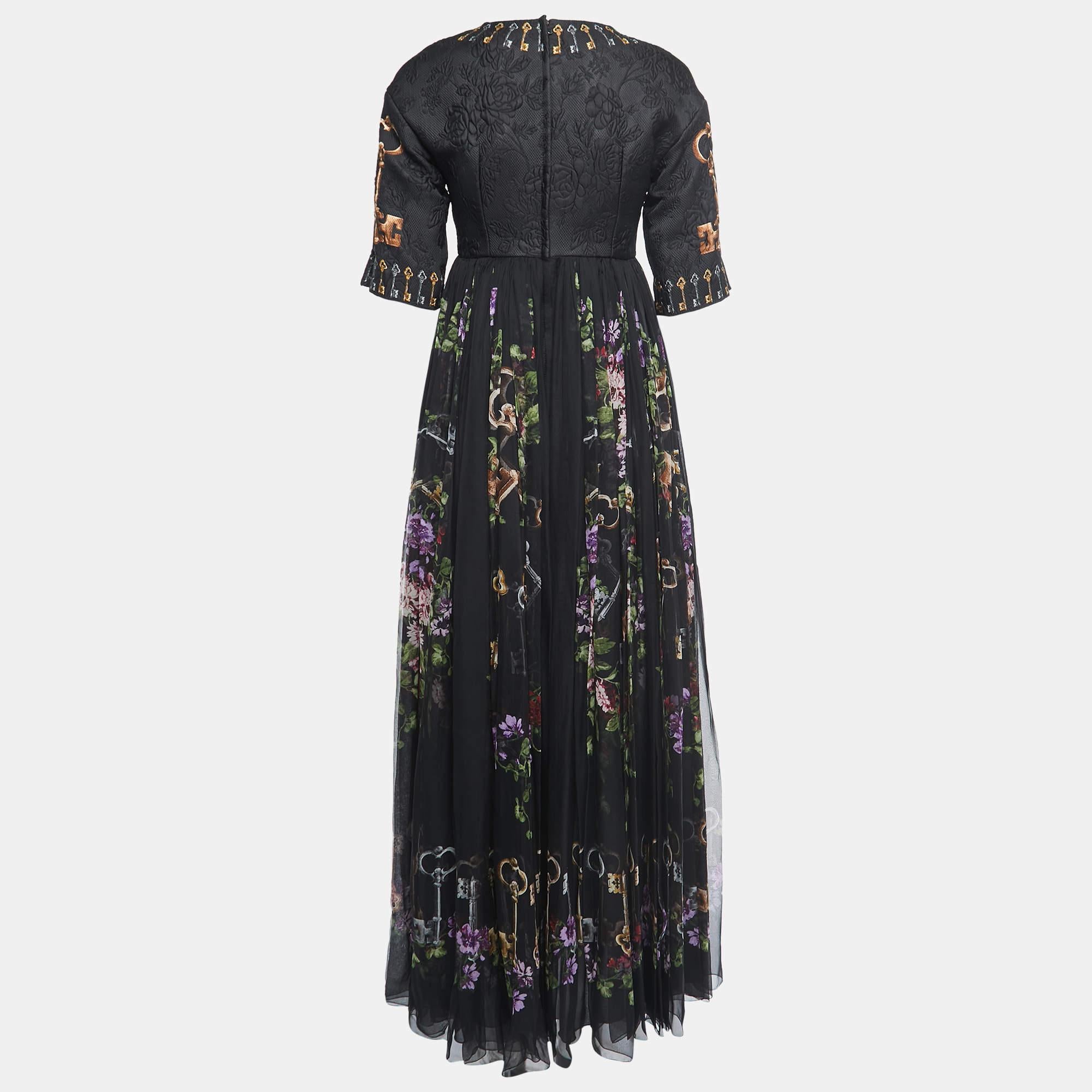 This Dolce & Gabbana dress is surely a wardrobe hero. The smartly updated black hue and the comfy shape make this one a day-to-night piece. The floral and key print flatters lending the dress an urbane touch. Pair it with printed heels for your