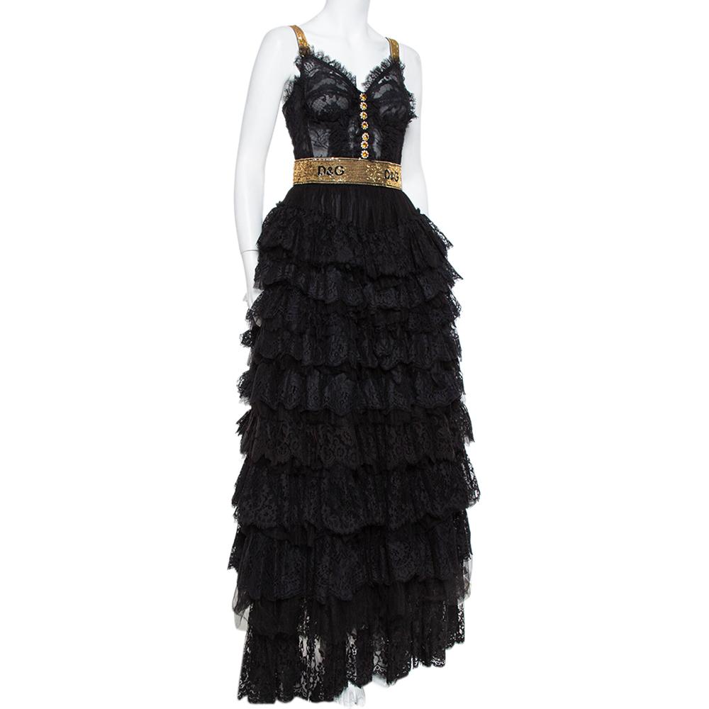 To help you sway in the most mesmerizing way, Dolce & Gabbana brings you this evening gown that is too beautiful for words. It is a marvelous design, achieved by using embellishments, floral lace, and tulle into a dreamy silhouette. The hemline