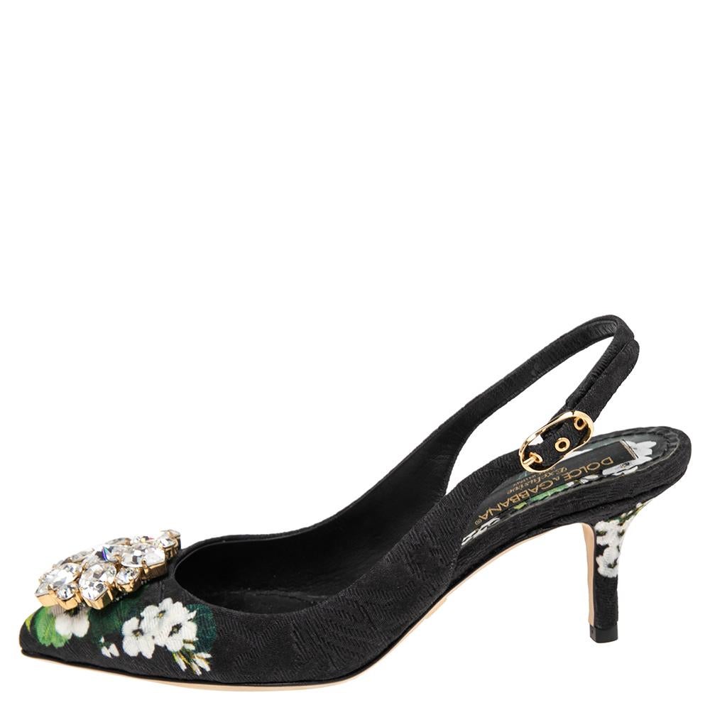 These slingback sandals from Dolce & Gabbana are indeed a treat for the eye and the soul. With their sumptuous design and intricately carved exterior, these sandals exude an aura of femininity and elegance. Their silhouette is characterized by the
