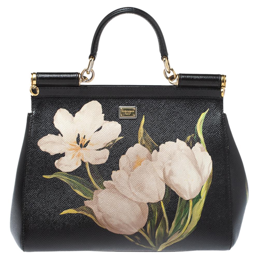 Floral print on leather never looked so good! The Sicily range of bags is one of the most celebrated creations from Dolce & Gabbana. This beauty beautifully embodies the spirit of extravagance and feminity that the Italian luxury brand carries. This