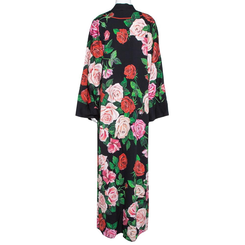 Don this stunning Abaya from Dolce & Gabbana. Crafted from quality materials, this ensemble comes in a classic shade of black. It flaunts a floral print all over that adds a touch of femininity. It has long sleeves, a hemline that touches the floor,