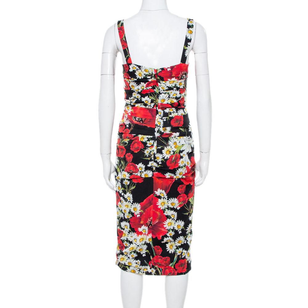 You'll find occasions to wear this beautiful dress from Dolce & Gabbana! It is made of a silk blend and features a floral print all over it. It flaunts ruched details and a flattering silhouette that is enhanced with a rectangular neckline. It