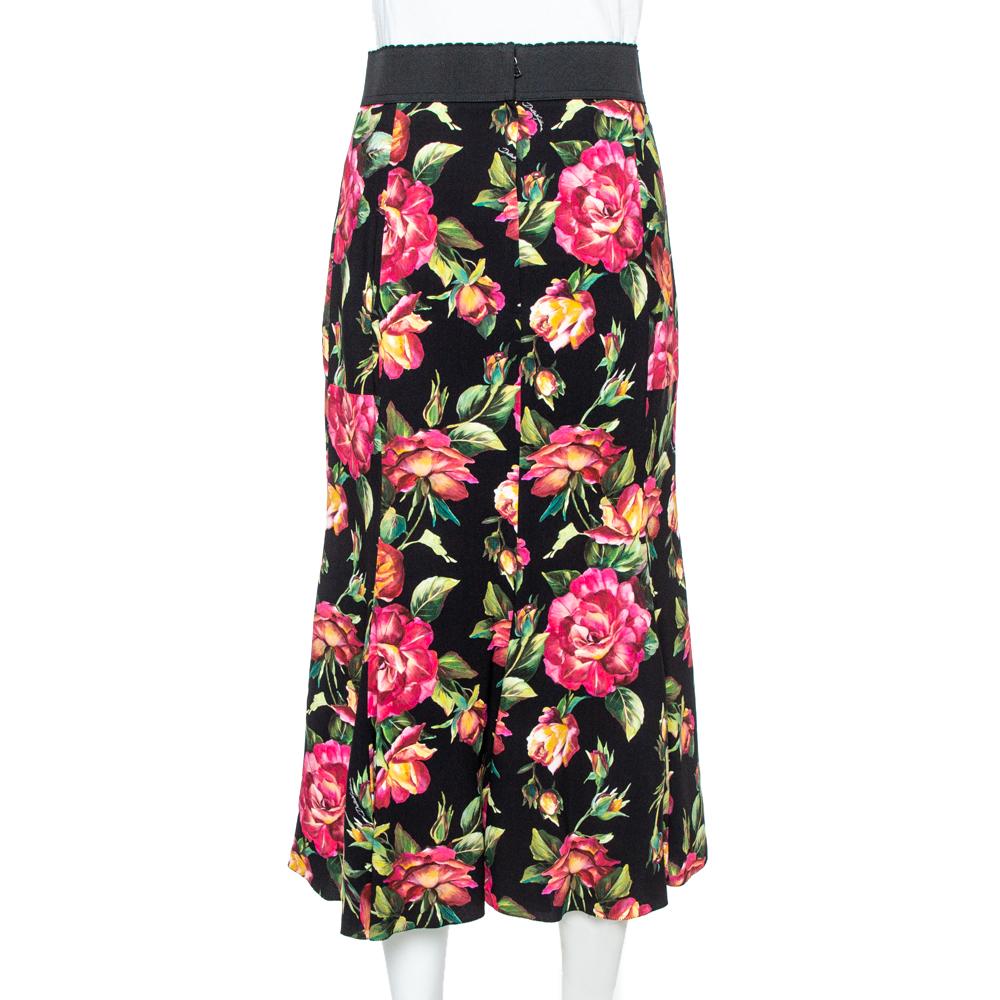 Dolce & Gabbana's skirt is graced with a flare that adds a subtle feminine charm to it. It comes in a beautiful black color with a lovely floral print all over, rear zip closure, and elasticized waistband. Wear this with a statement top and heels