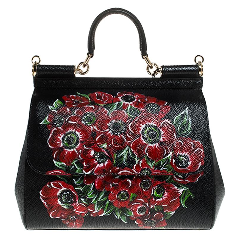 This gorgeous black Miss Sicily bag from Dolce & Gabbana is a handbag coveted by women around the world. It has a well-structured design and a flap that opens to a compartment with fabric lining and enough space to fit your essentials. The bag comes