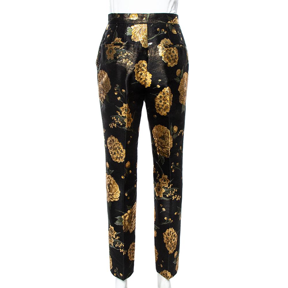 Dolce & Gabbana's trousers are made from black and gold fabric woven in jacquard. They're cut to sit high on the waist and have straight legs. Wear a golden satin shirt atop and flaunt a glam look.

