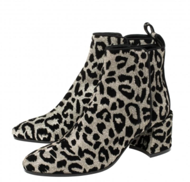 Known for its finesse and impeccable artistry, Dolce & Gabbana again surprises us with these stylish boots. Crafted from leopard-printed lurex, the boots feature almond toes and are lined with leather. Block heels complete these beauties.