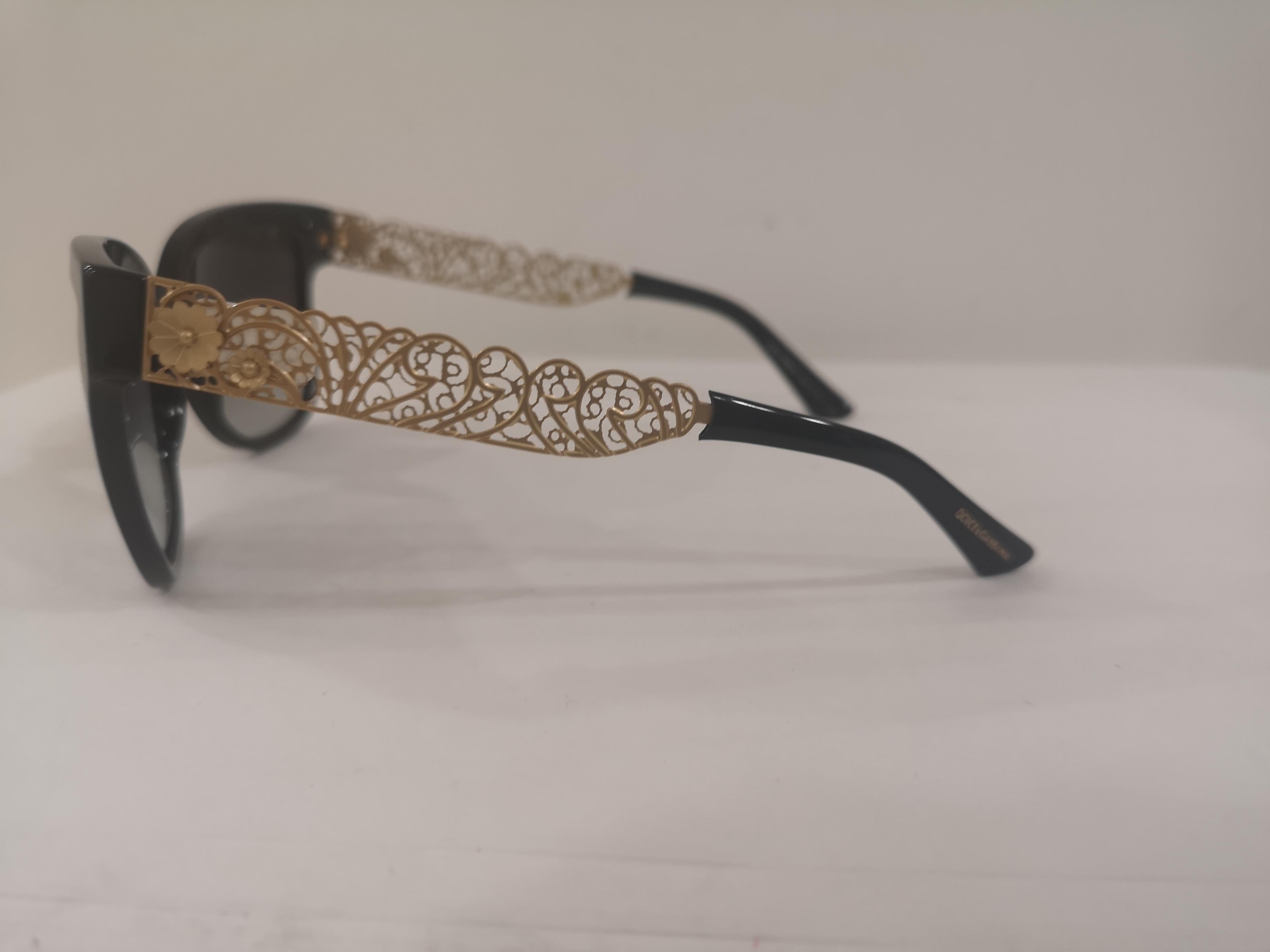 Dolce & Gabbana black gold sunglasses NWOT
Black sunglasses gold handmade stem
totally made in italy
still with box