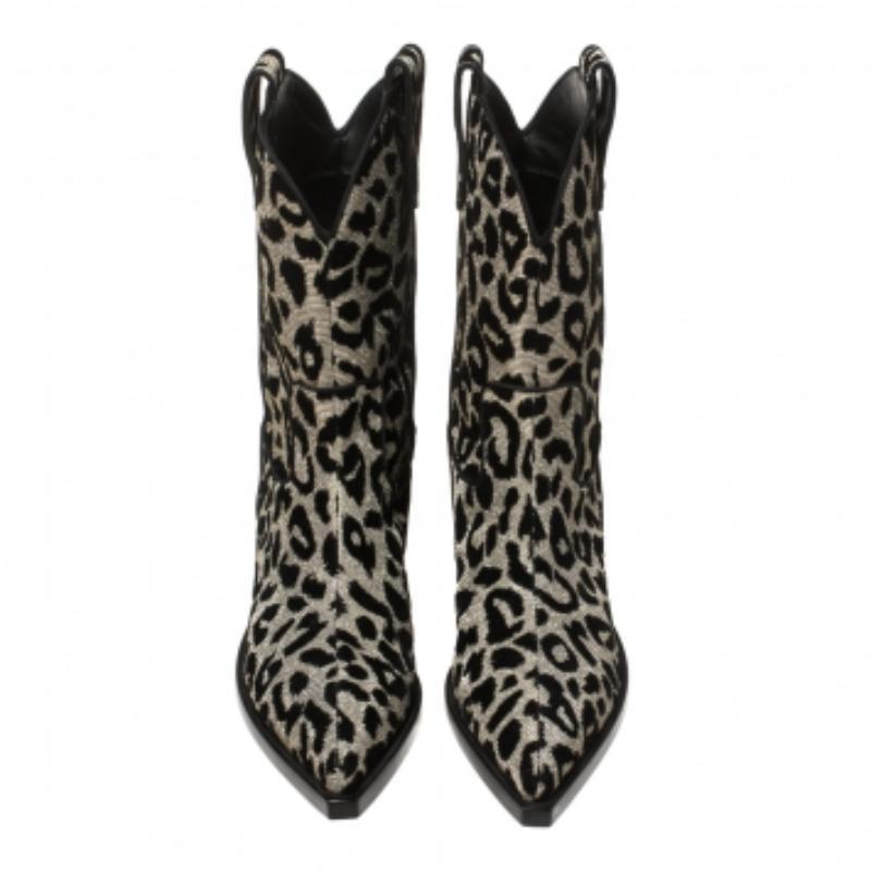 Known for its finesse and impeccable artistry, Dolce & Gabbana again surprises us with these stylish cowboy boots. Crafted from shimmering leopard-printed fabric, the boots feature pointed toes and are lined with leather. Small heels complete these