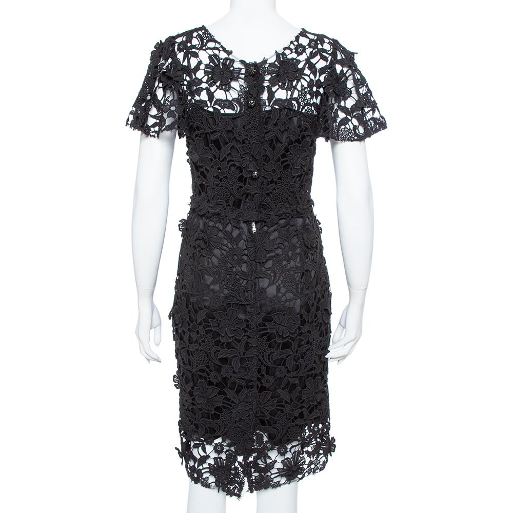 Masterful tailoring and impeccable craftsmanship characterize this dress from the house of Dolce & Gabbana. Covered in a floral Guipure lace overlay, this one is all about elegance and a flawless finish. This black beauty is nothing but pure charm