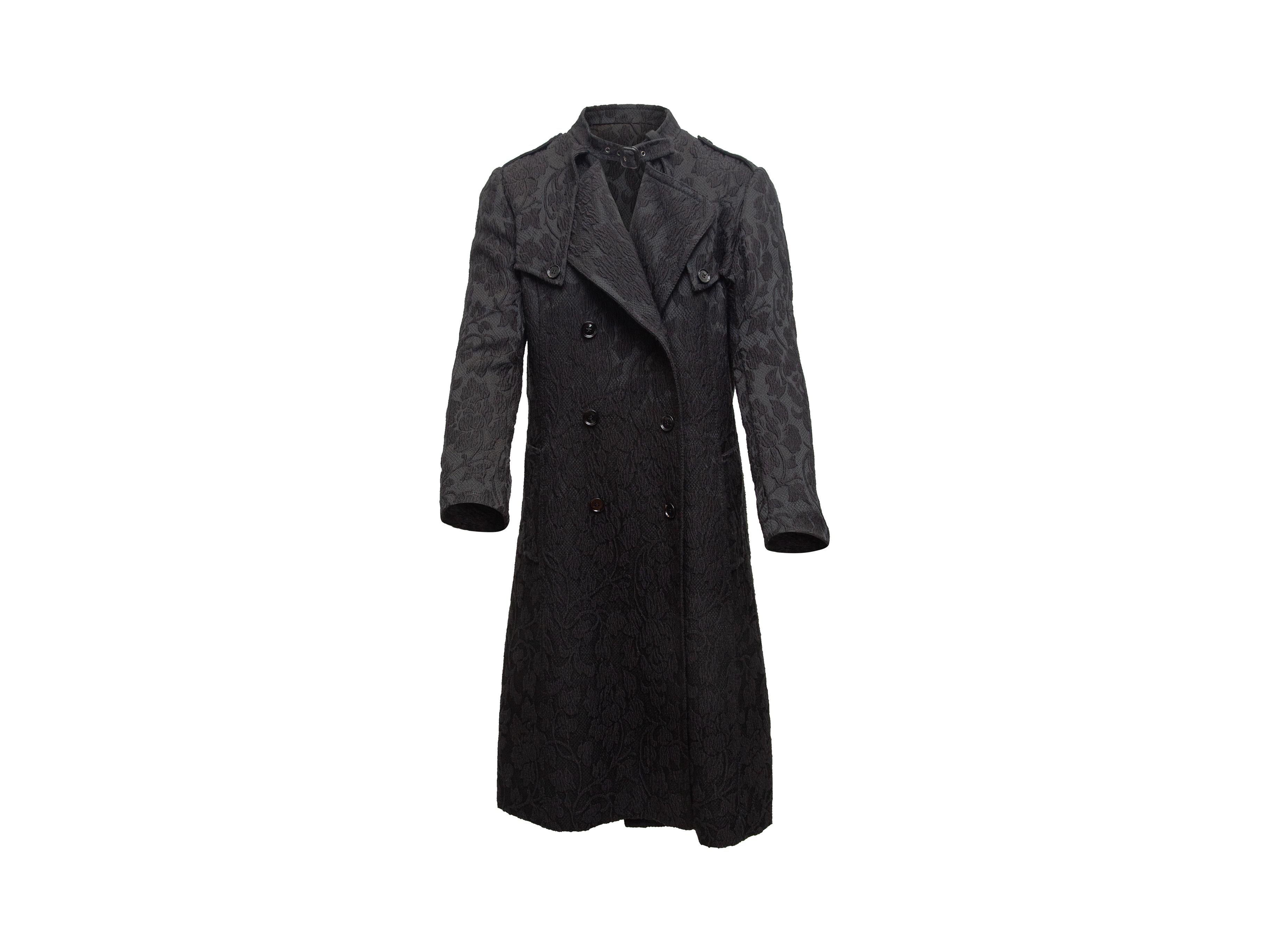 Product details: Black jacquard double-breasted coat by Dolce & Gabbana. Dual hip pockets. Button and buckle closures at front. Designer size 42. 38