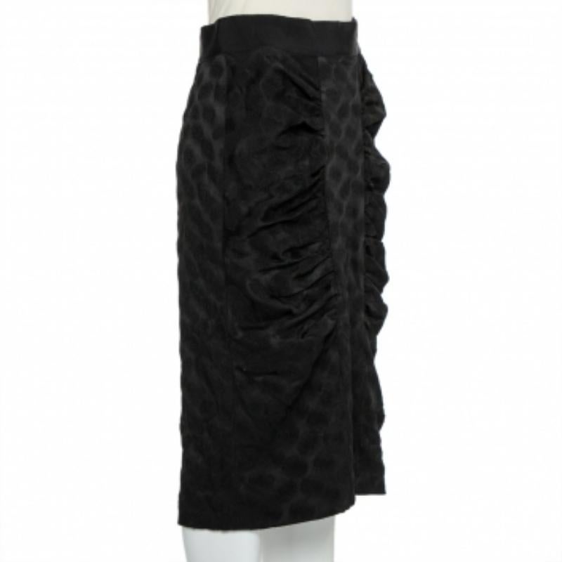 Your wardrobe is incomplete without a pencil skirt and what better than this one from Dolce & Gabbana! The skirt features a flattering silhouette and draped details. It comes equipped with a zip closure at the back and will look amazing with a crisp