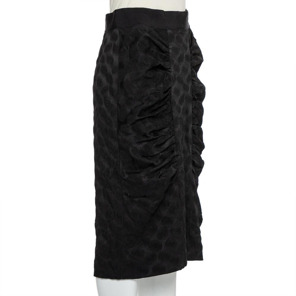Your wardrobe is incomplete without a pencil skirt and what better than this one from Dolce & Gabbana! The skirt features a flattering silhouette and draped details. It comes equipped with a zip closure at the back and will look amazing with a crisp