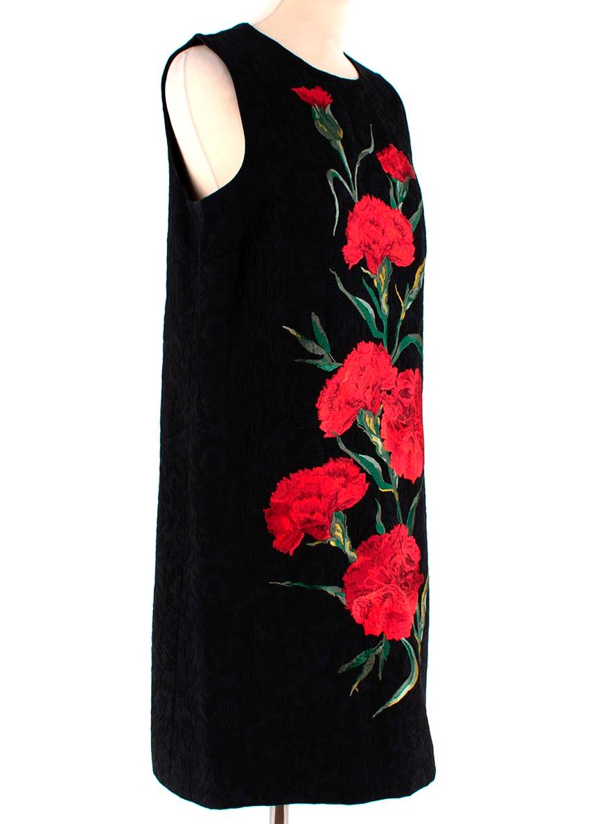 DOLCE & GABBANA 
Black dress with red and green floral embroidery.

- Crafted from floral printed 
- Cotton blend brocade 
- Short sleeveless dress 
- Crew neck, rear concealed 
- Zip Fastening 
- A-line silhouette
- Completely lined
- Lining, 100%
