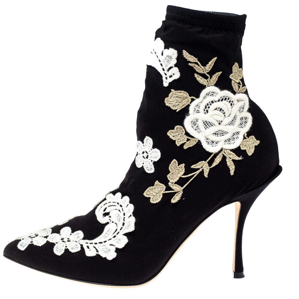 Contemporary and edgy, these booties from Dolce & Gabbana deserve a special place in your wardrobe! The booties have been crafted from fabric and feature a pointed-toe silhouette. They have been styled with floral embroidery. Leather-lined insoles,