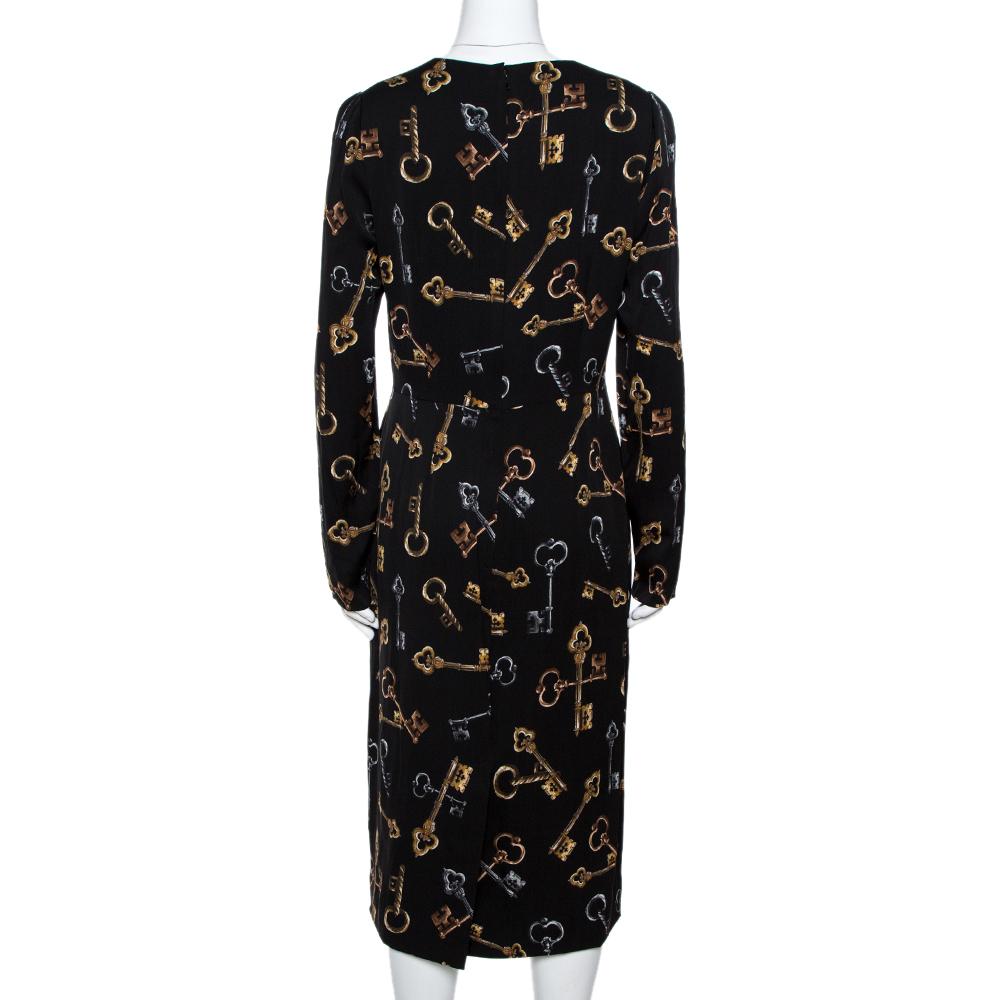 From the house of Dolce & Gabbana, this dress is a wonderful creation. Designed for a contemporary look, this black sheath dress features long sleeves, zip closure, and prints of keys all over.

Includes: Price Tag