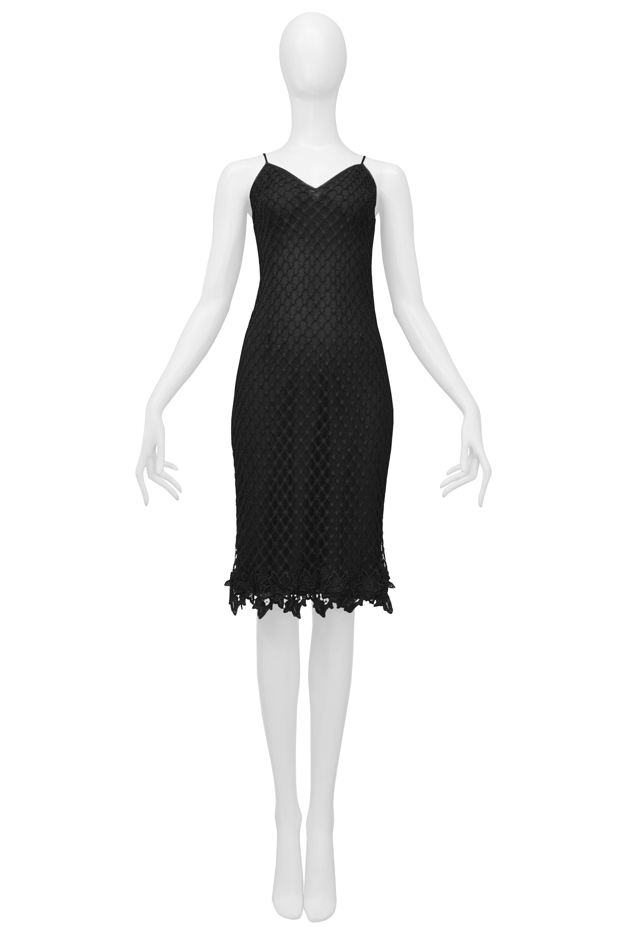 Resurrection Vintage is excited to offer a vintage Dolce & Gabbana black slip dress featuring a fishnet overlay, attached under slip, skinny straps, lace trim, and knee-length. 

Dolce & Gabbana
Size 42
Viscose 
Excellent Vintage Condition