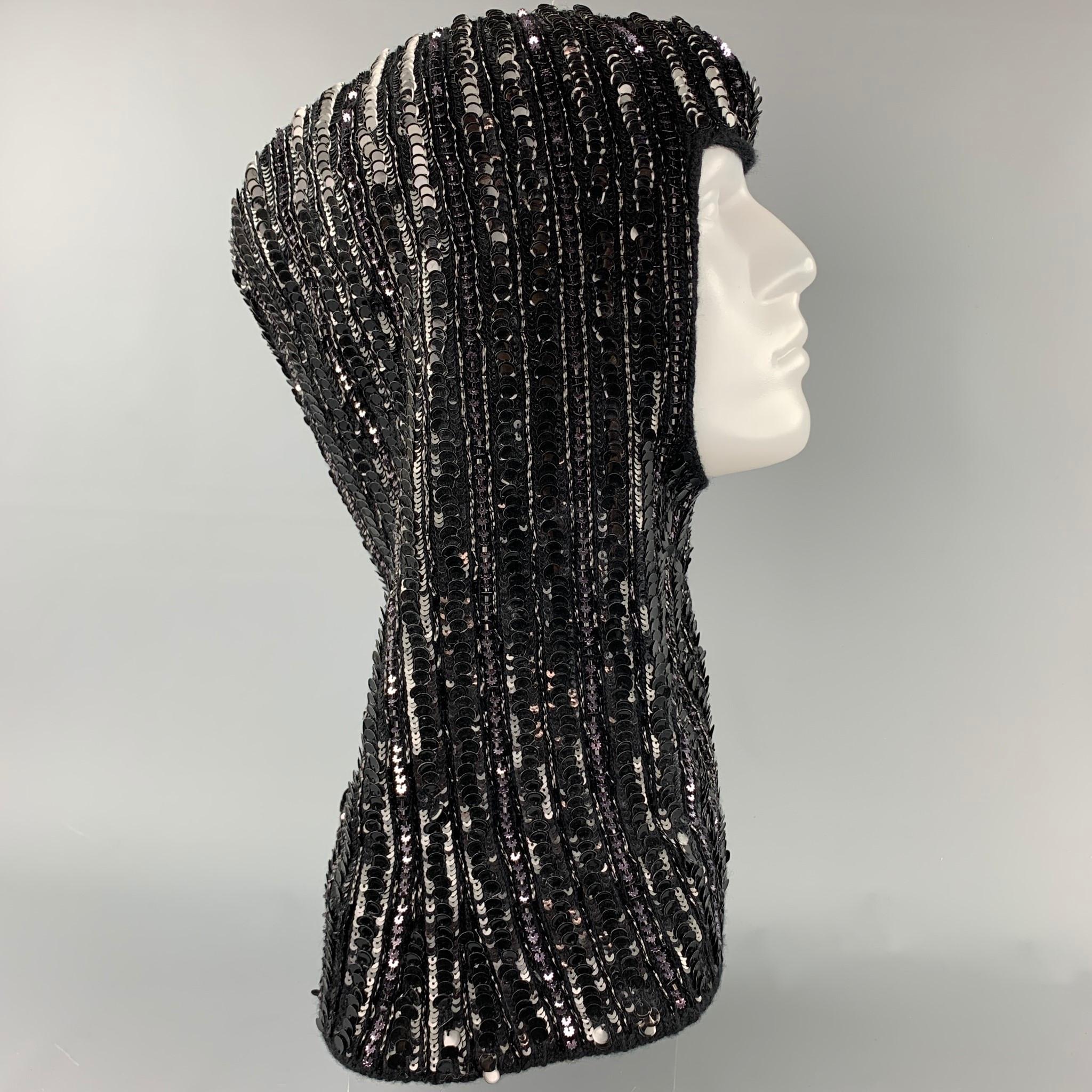 DOLCE & GABBANA hat comes in a black knitted sequin wool blend featuring a hood scarf style. Comes with box. Made in Italy.

New With Tags. 
Marked: PZ
Original Retail Price: $2,055.00

Measurements:

Length: 19.5 in.
Width: 15.5 in.
Opening: 12 in.