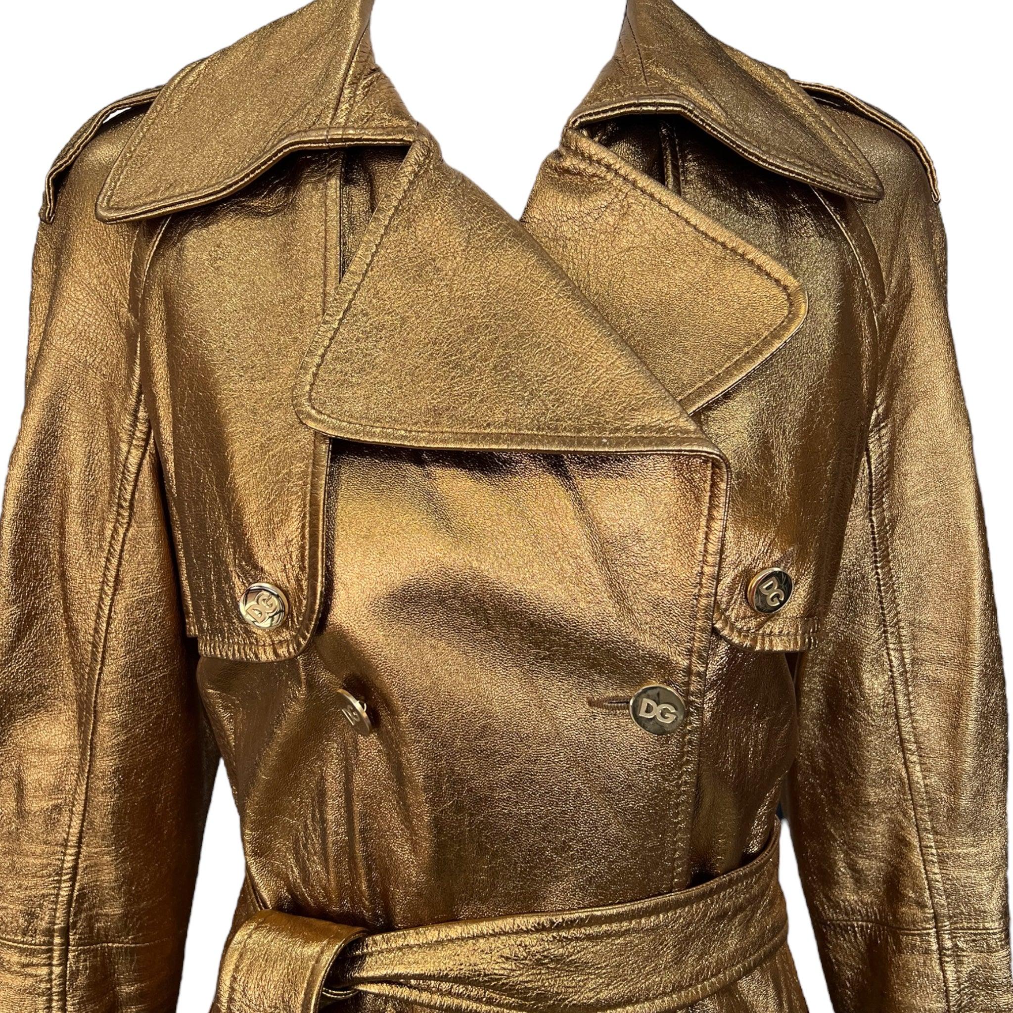 Dolce & Gabbana black label metallic bronze leather double breasted trench coat. Tie belt, pockets, and leopard lining. Midi length. From Dolce & Gabbana's Autumn Winter 2023 collection.  Excellent condition.

Additional