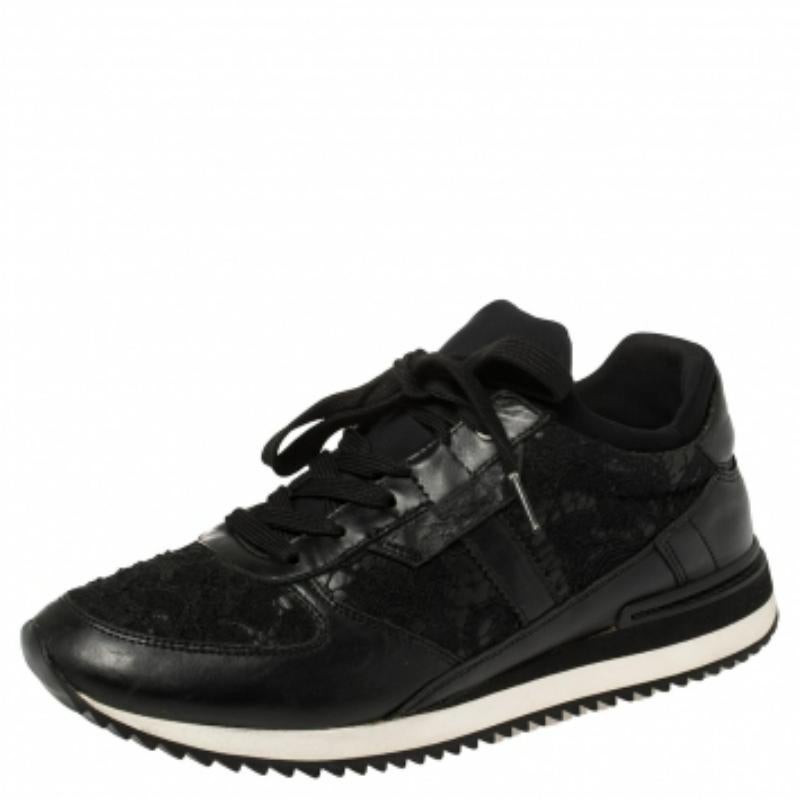 Fall in love with casual wear every time you step out in these low-top sneakers from Dolce & Gabbana. They've been crafted from lace and leather and styled with round toes and lace-ups on the vamps. The black sneakers are endowed with comfort and