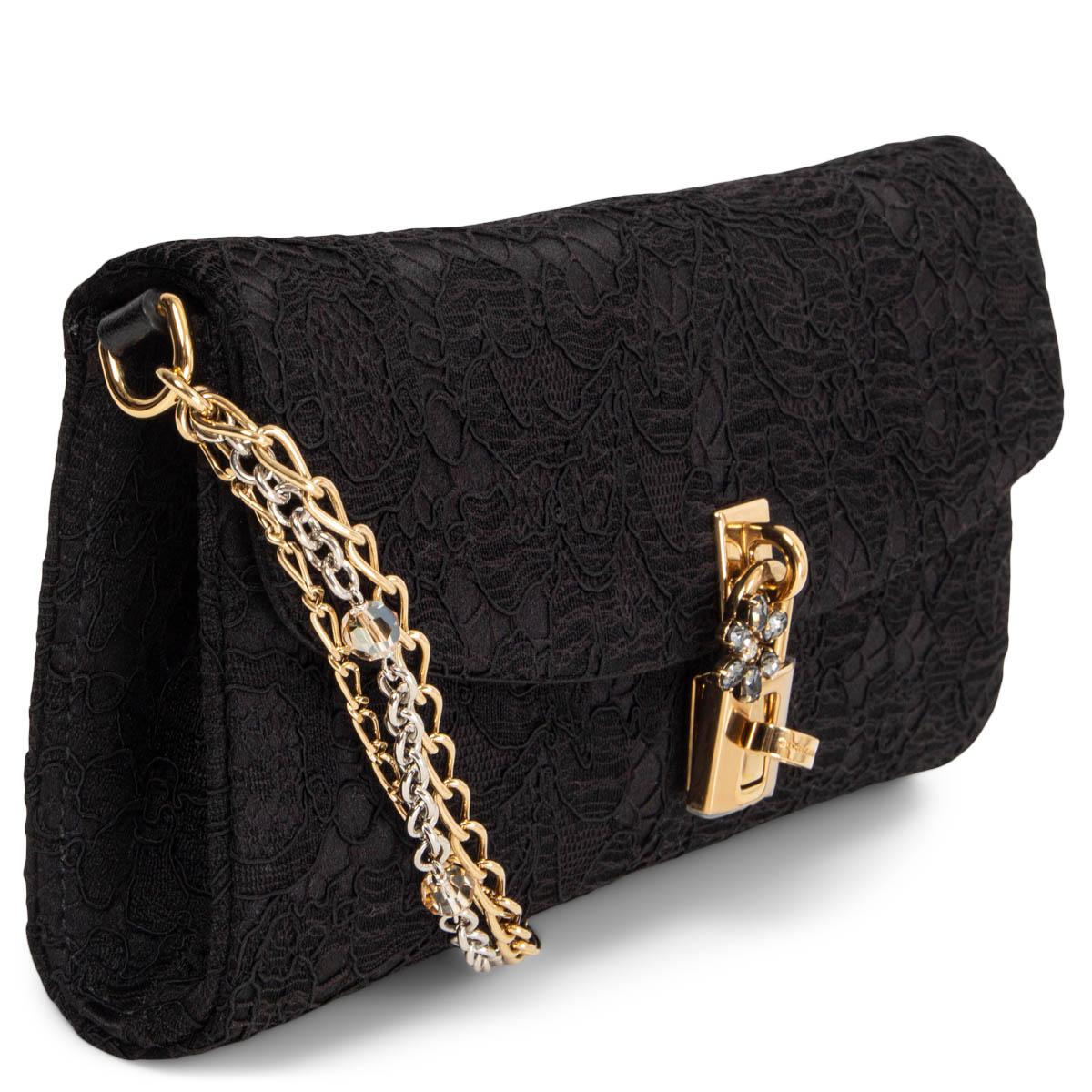 100% authentic Dolce & Gabbana Pizzo Taormina shoulder bag in black lace and satin with a crystal embellished gold-tone turn-lock closure. Lined in black satin with a slit pocket and a pocket lipstick mirror. Has a gold- and silver-tone chain-link