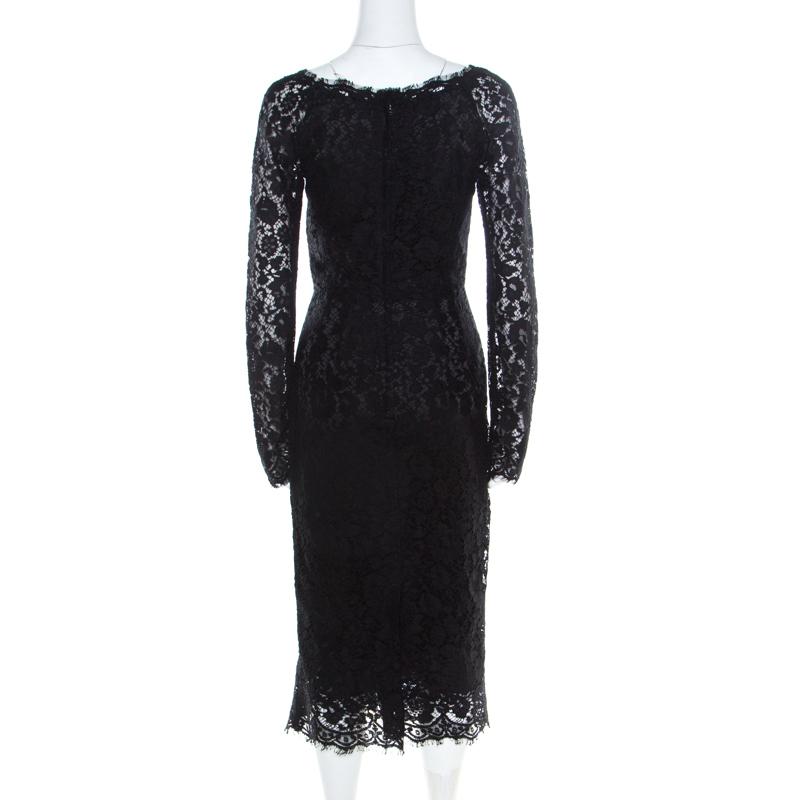 Make room in your closet for this graceful attire from the house of Dolce&Gabbana. Designed for a subtle look, this black midi dress is fabulous for an evening event. This dress features lace overlay, full sleeves and a back zipper.

Includes: The