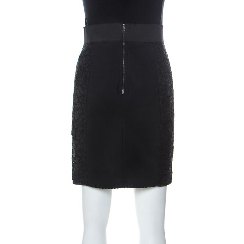 This elegant mini skirt from Dolce & Gabbana features a black lace-detailed body rendered in a nylon-cotton blend with an elastic waistband. Make this versatile piece an evening staple of your wardrobe. The zipper detail to the back and smart fit