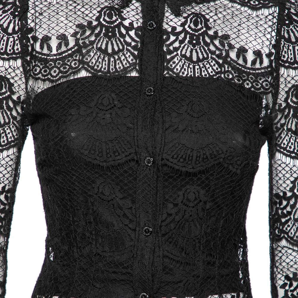 How stunning and elegant is this full sleeve shirt from Dolce & Gabbana! With its exquisite lace body and a classic shade of black, it is sure to become your favorite piece for special occasions. It is finished with front buttons and has a lovely,