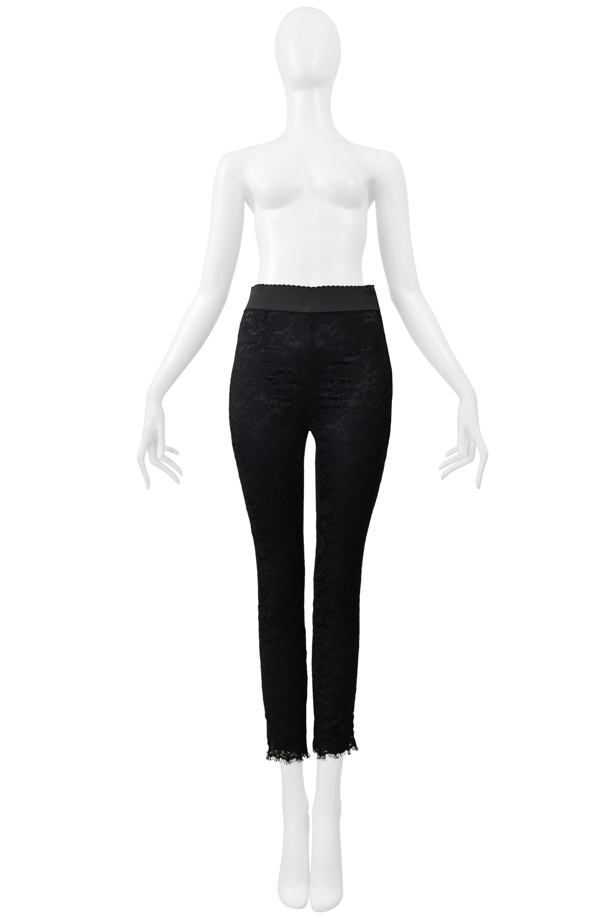 Resurrection Vintage is excited to offer a pair of Dolce & Gabbana black lace leggings featuring floral lace with scalloped edges, an elastic waistband, a side zipper, black rayon lining, and ankle zippers. 

Dolce & Gabbana

Size: No Size Label -
