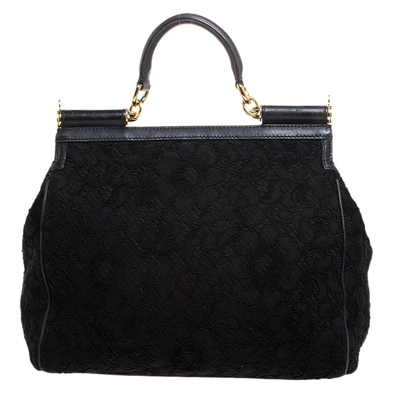 This gorgeous black Miss Sicily bag from Dolce & Gabbana is a handbag coveted by women around the world. It has a well-structured design and a flap that opens to a compartment with satin lining and enough space to fit your essentials. The bag comes