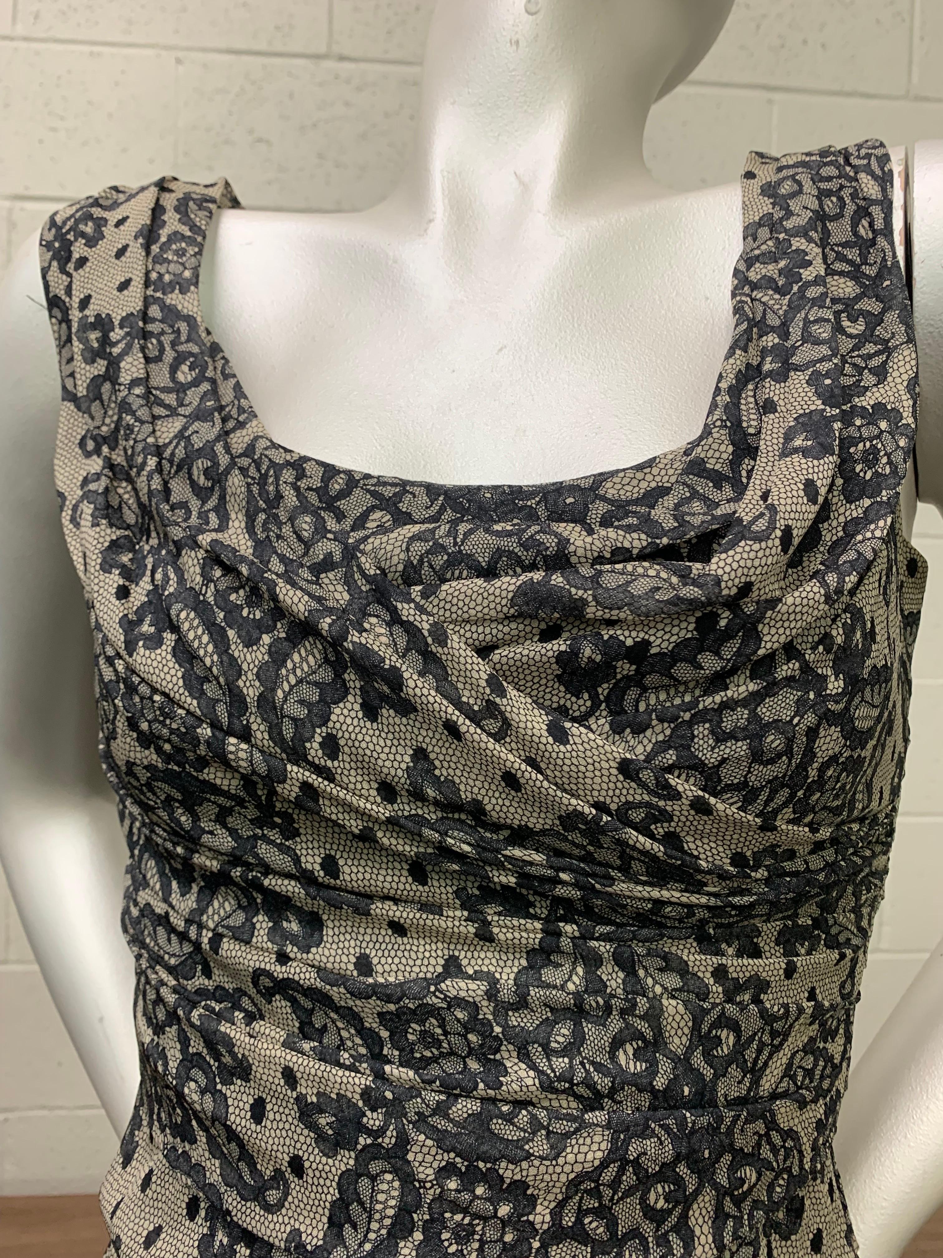 A fabulous, sexy, contemporary Dolce & Gabanna classic sheath dress in ruched stretch silk, printed with a black and ecru lace pattern. Back zipper. Squared neckline and wide straps. Pristine condition. Size 42. 