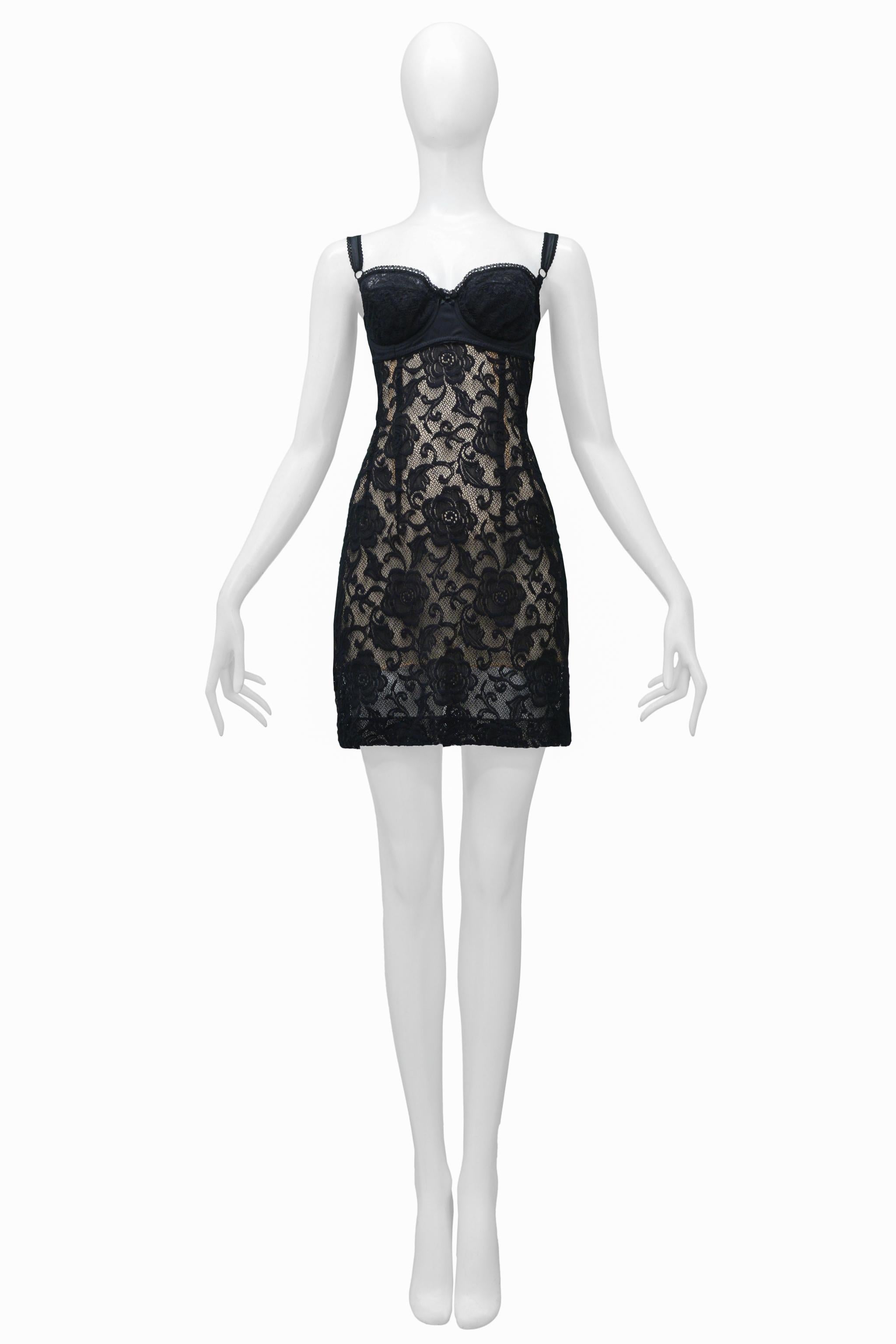 Resurrection Vintage is excited to offer a vintage Dolce & Gabbana black lace dress featuring an attached bra, skinny straps, nude tone underslip, and mini length. 

Dolce & Gabbana
Size: Small
Viscose and Nylon
Excellent Vintage Condition - Never