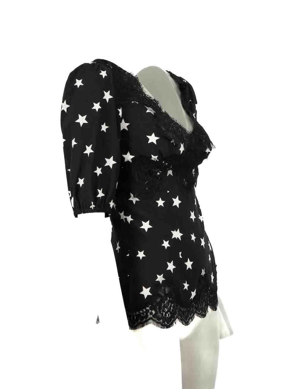 CONDITION is Never worn. No visible wear to top is evident on this new Dolce & Gabbana designer resale item.

Details
Black
Silk
Mid sleeves blouse
Star print pattern
Lace trim
Slightly see through
V neckline
Side zip closure
 
Made in Italy
